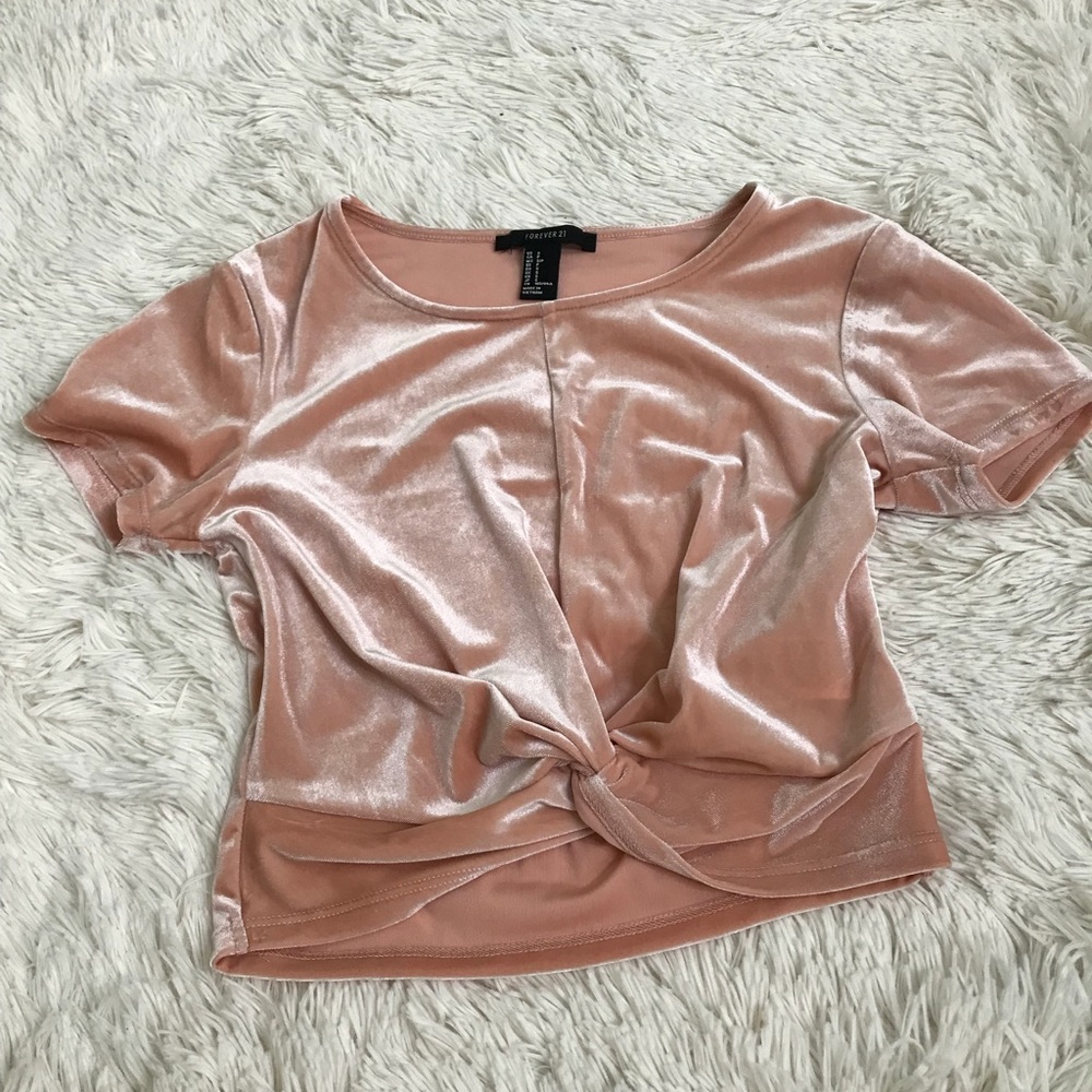 A peach crop top with a twist knot